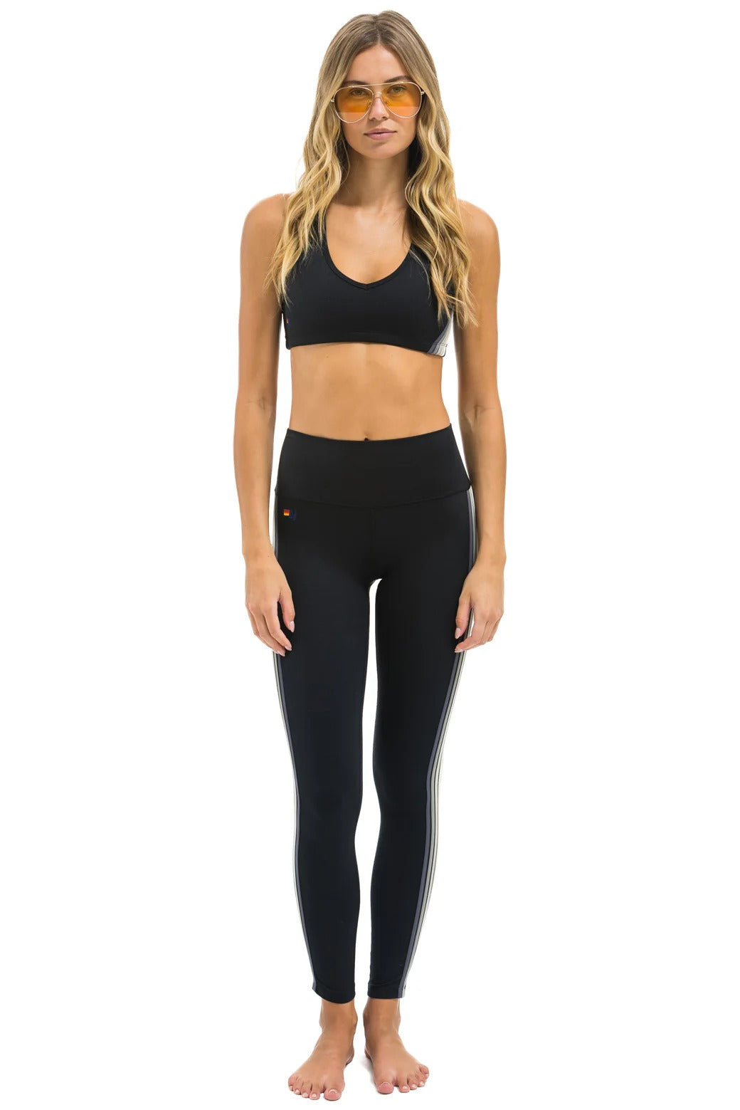 High-rise full-length leggings featuring five stripes, designed for performance and comfort during workouts and daily wear-5